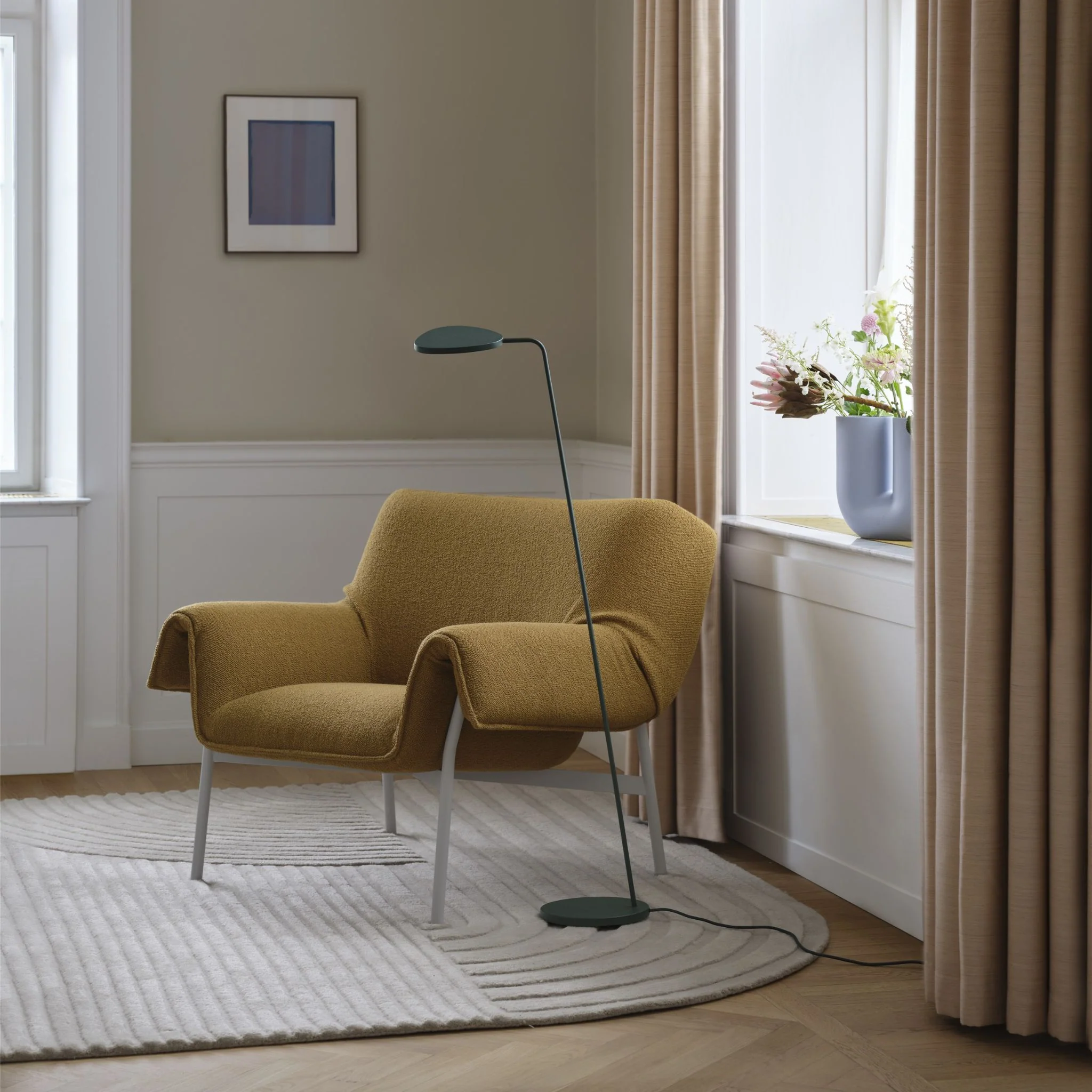 muuto-wrap-lounge-chair-in-situ-with-leaf-floor-lamp.webp